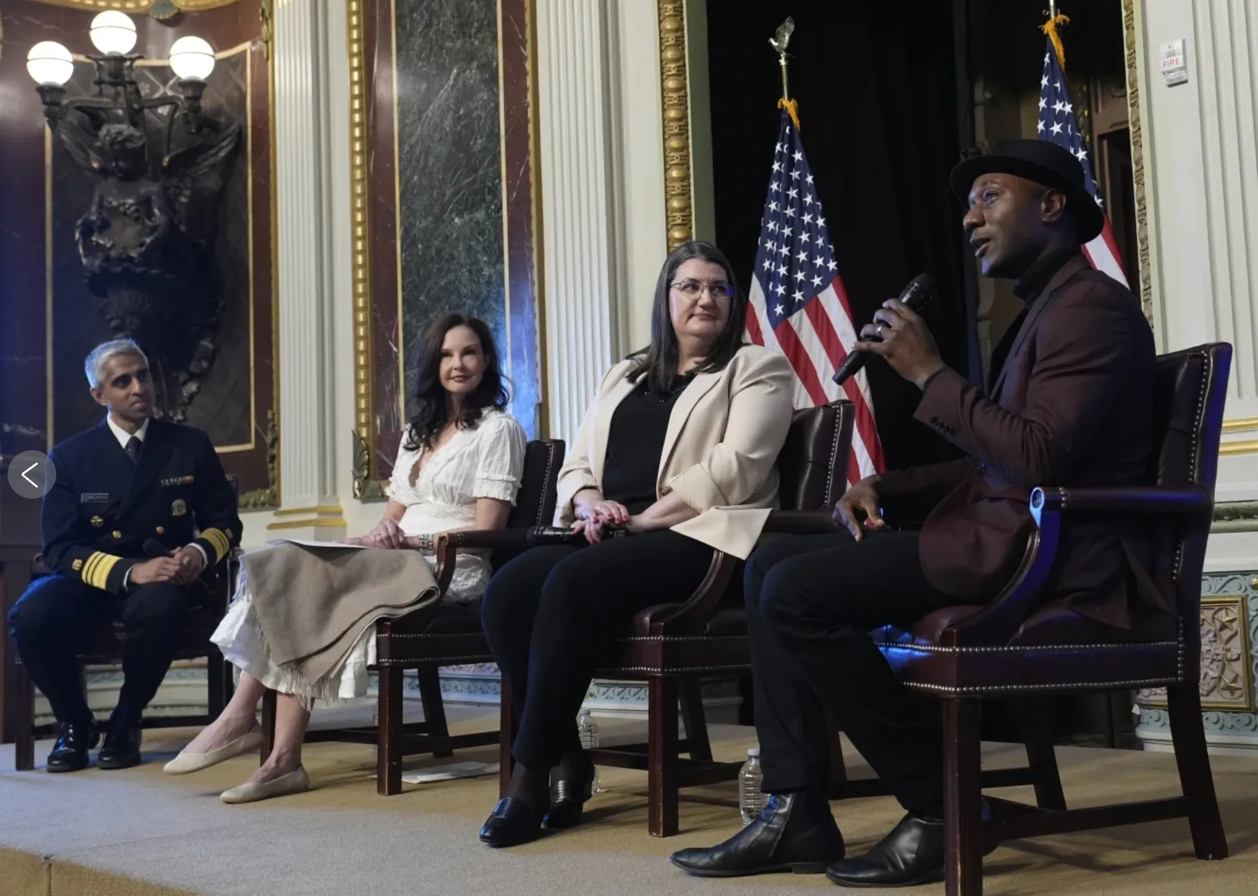 Photo of 4 people sitting on a stage: Dr. Vivek Murthy, Ashley Judd Shelby Rowe and Aloe Blacc speaking