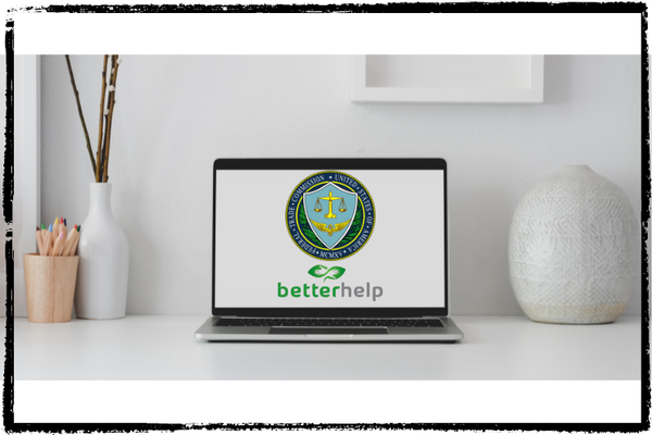 Photo of a laptop on a counter w/decorative items. On the screen is the FTC shield and BetterHelp logo
