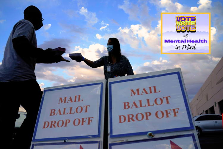 Photo of a person handing his ballot to an elections representative who stands behind signs, "Mail Ballot Drop Off"